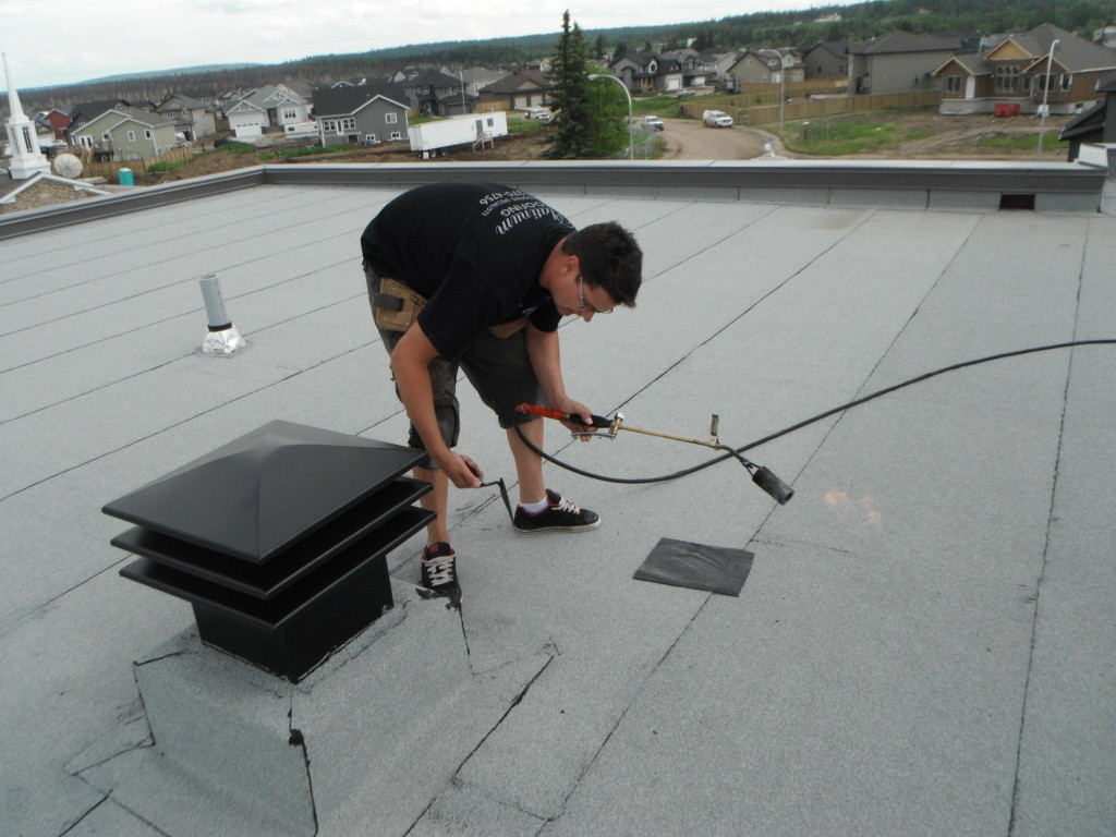 Platinum Roofing installing SBS roof membrane in Calgary Alberta